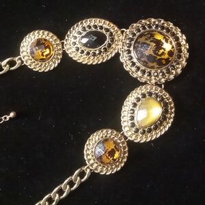 Animal print bib collar necklace gold tone .